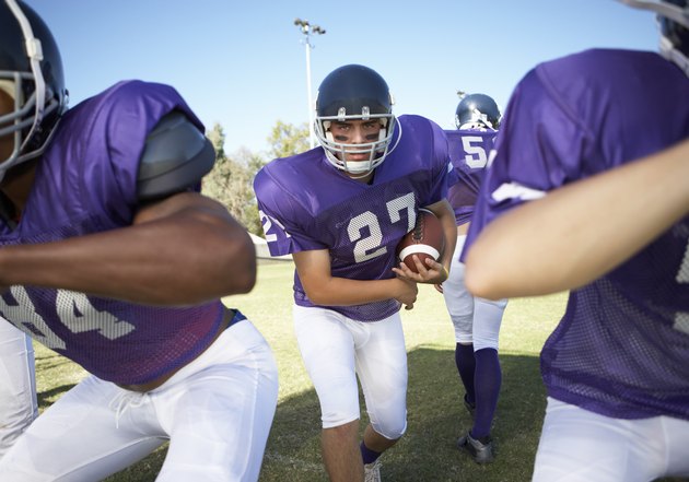 Running Back behind Linemen