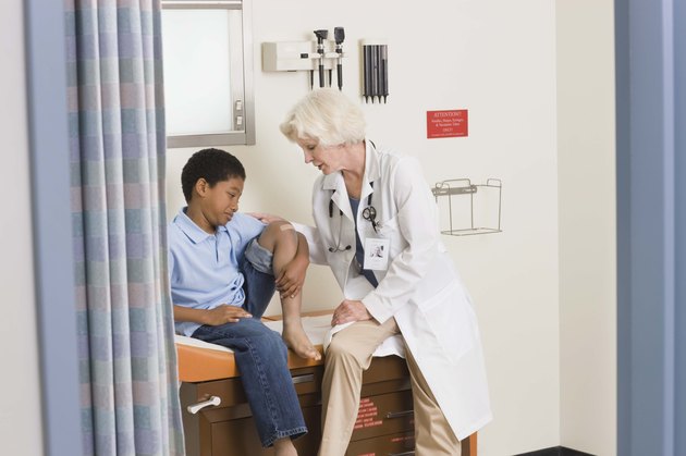 Boy in examining room with doctor