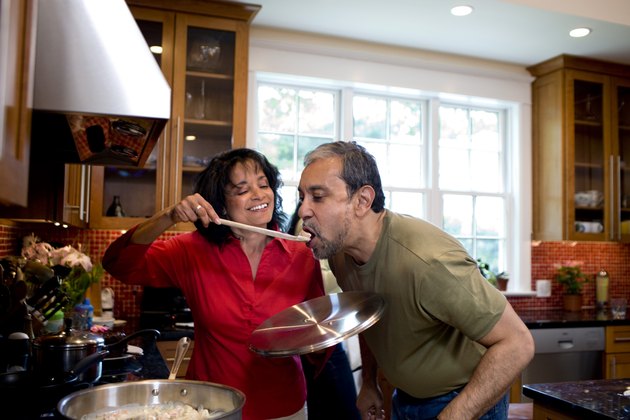 Mature couple cooking together