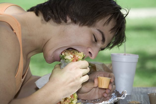 Close-up of a young man eating