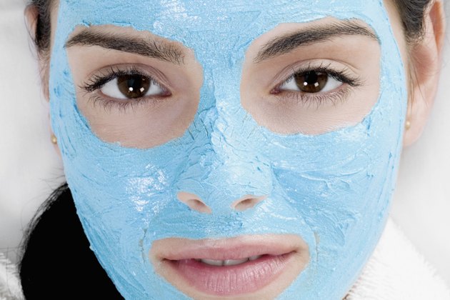 Portrait of a young woman with a facial mask