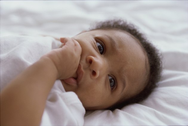 Close-up of a baby boy sucking his thumb