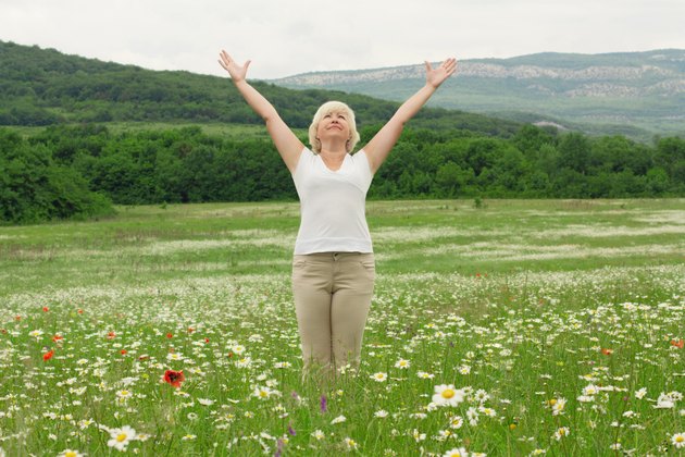 Senior woman doing yoga exercises