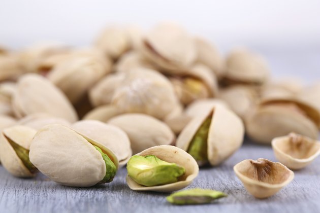 Pistachio nuts on table close up
