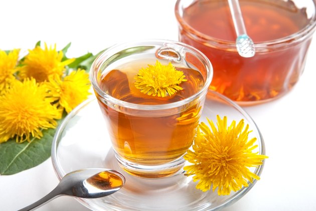 dandelion herbal tea on white background, with honey and leaf