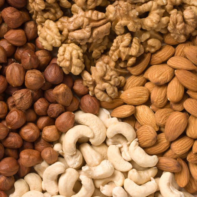 Different nuts (almonds, cashews, walnuts and filbers) close up