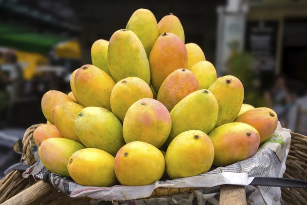 Basket full of ripe mangoes