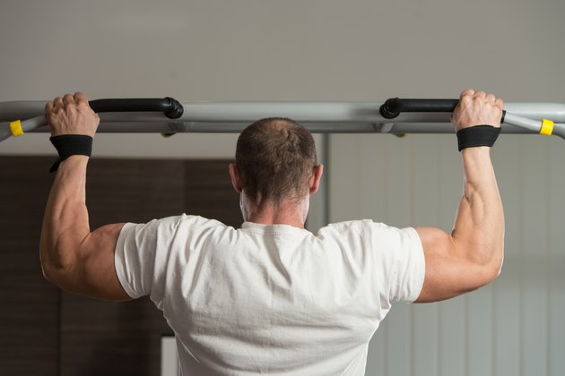 Bodybuilder Doing Pull Ups Best Back Exercises