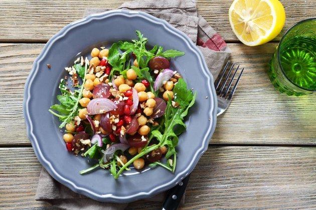 Salad with chickpeas, arugula, food closeup