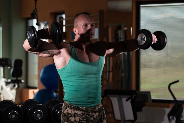 Young Man Preforming Dumbbell Lateral Raise - Exercise For Shoulders