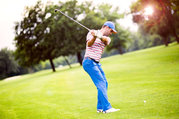 Golfer practicing and concentrating before and after shot