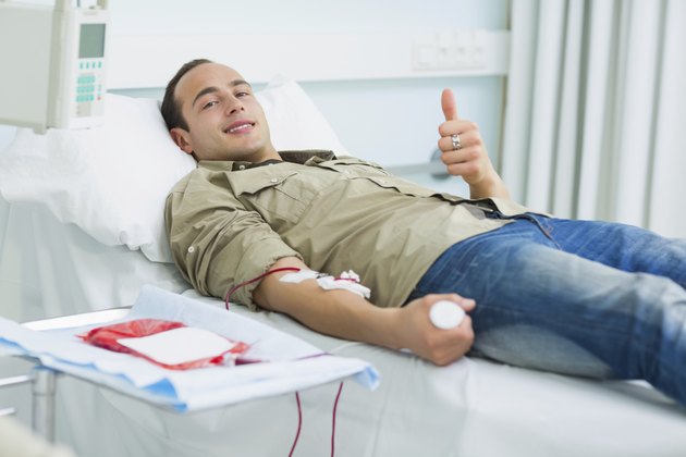 Smiling transfused patient lying on a bed