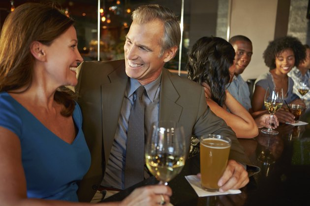 Mature Couple Enjoying Drink In Bar Together