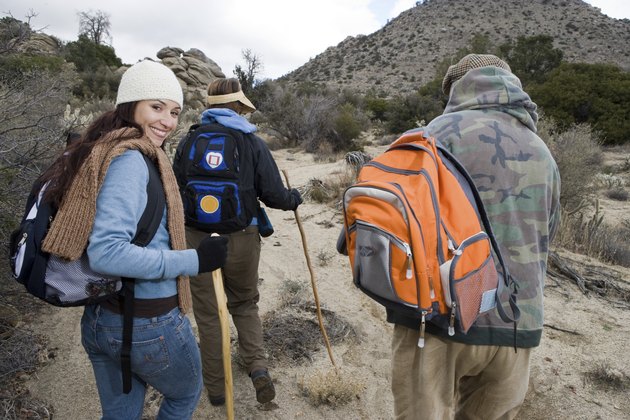 Three people hiking, portrait