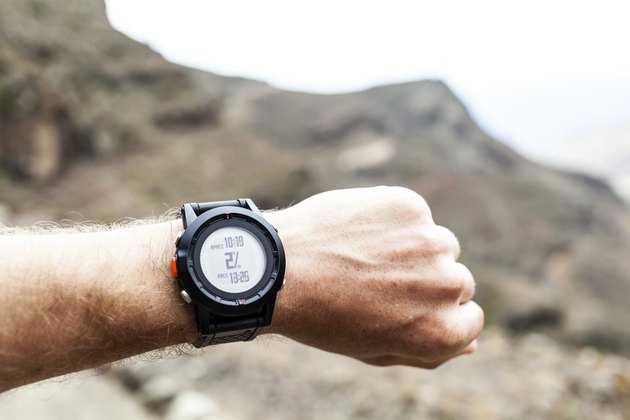 Runner looking at sport watch