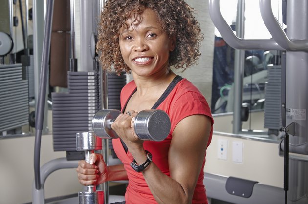 Woman using dumbells