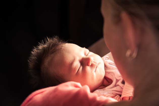 Newborn baby on mother hands