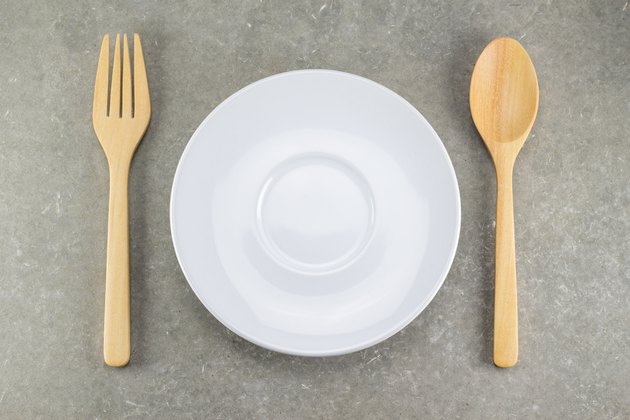 wood spoon and fork with white dish