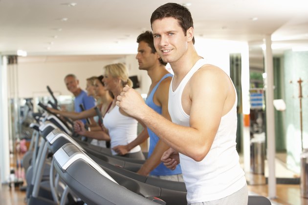 Man On Running Machine In Gym