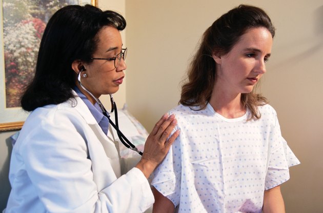 Doctor Inspecting Woman