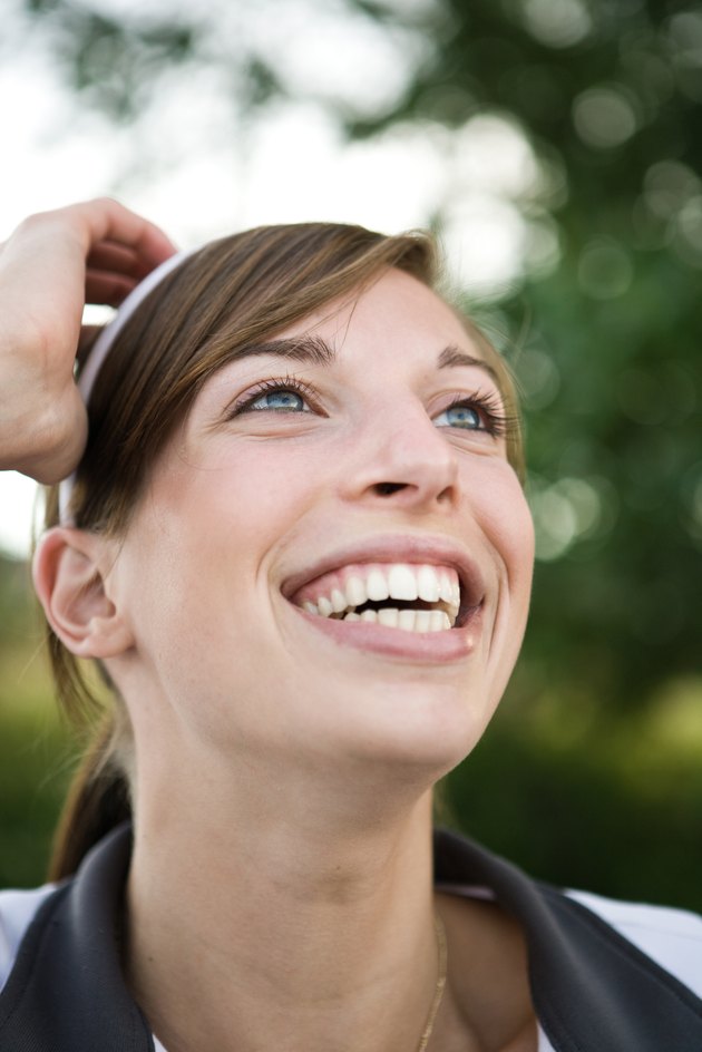 Outdoor head shot of smiling woman