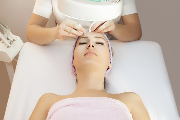 Young woman receiving beauty therapy