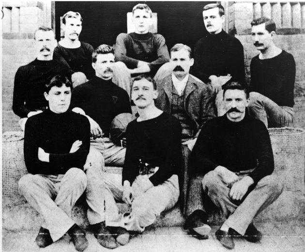 Portrait of Canadian physician and teacher Dr. James Naismith (1861 - 1939), inventor of the game of basketball, with his first basketball team, Springfield, Massachusetts, 1891. Naismtih invented the game as an indoor wintertime diversion for the football players. (Photo by Hulton Archive/Getty Images)