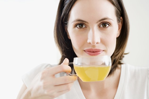 Woman drinking green tea