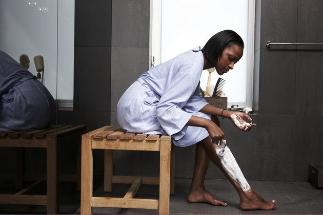 Woman grooming in modern bathroom