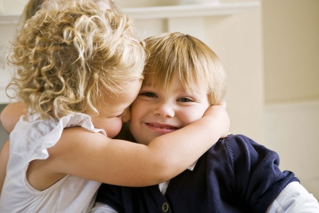 Girl kissing boy