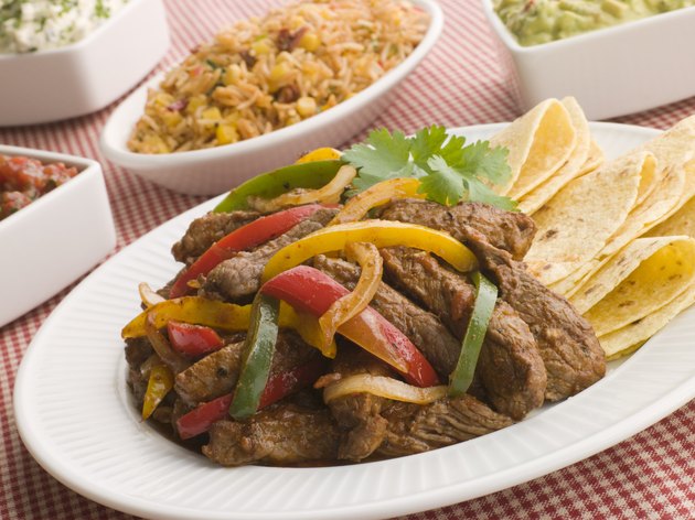 Steak Fajitas with Jambalaya Guacamole Salsa and Sour Cream