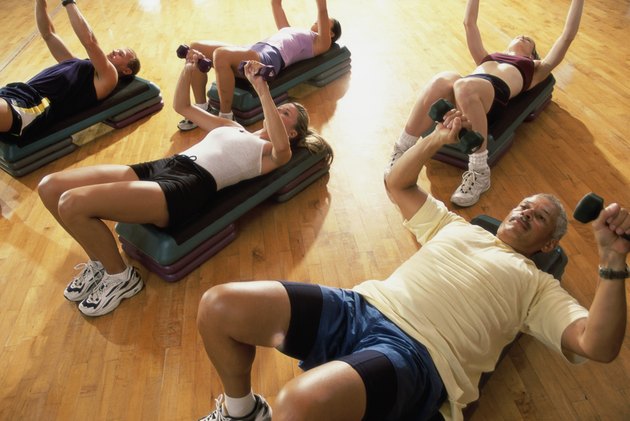 High angle view of a group of people exercising in a step aerobics class
