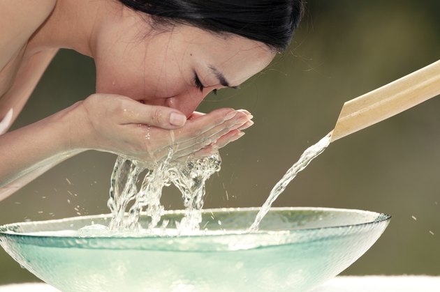 Woman washing face