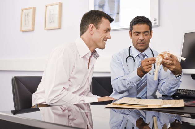 Doctor with patient in office