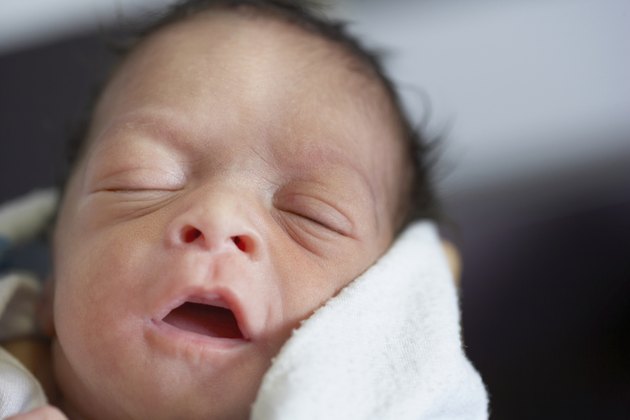 Close up of newborn African baby sleeping
