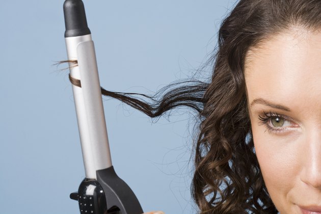 Woman curling her hair