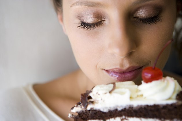 Woman smelling cake