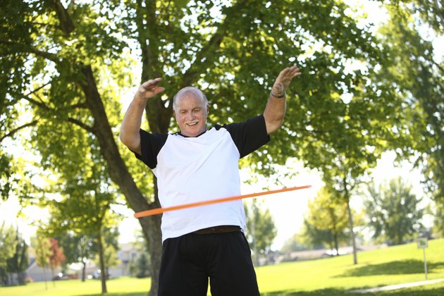 Senior man with hula hoop