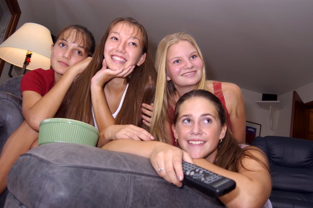 Teenage girls watching television