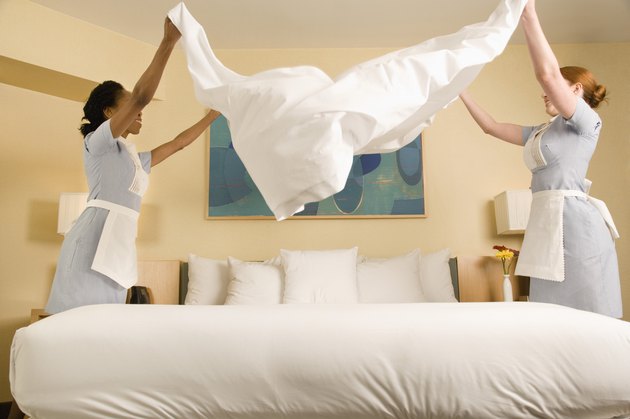 Maids making bed