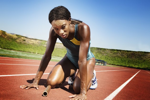 Athletic woman resting after race