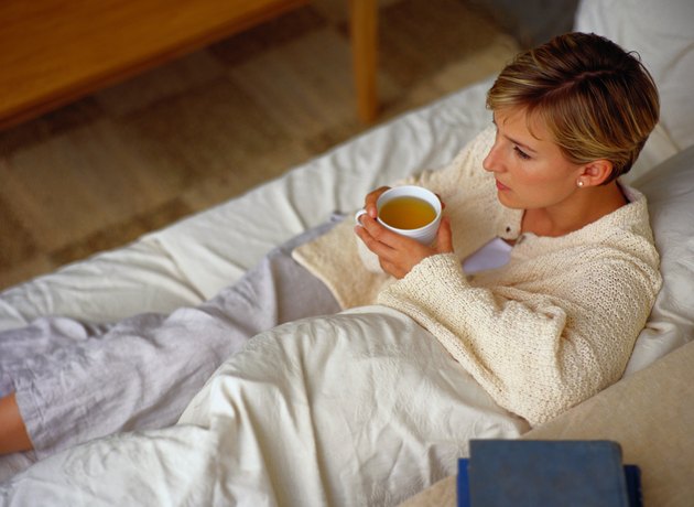 Young Woman Relaxing with a Cup of Tea
