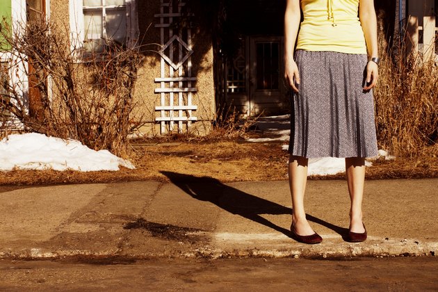 Woman waiting on the curb