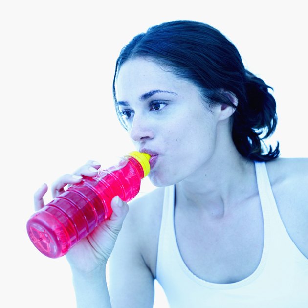 Close-up of a young woman drinking from a bottle