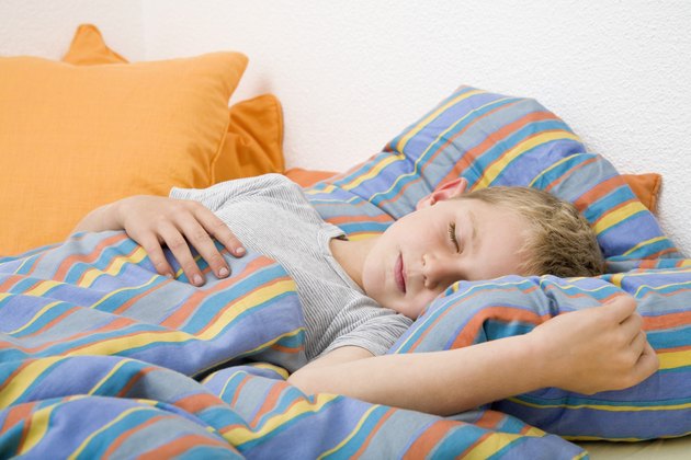 Boy sleeping in bed
