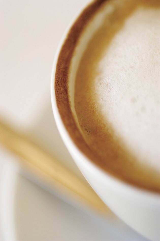 Overhead view of cappuccino in white cup