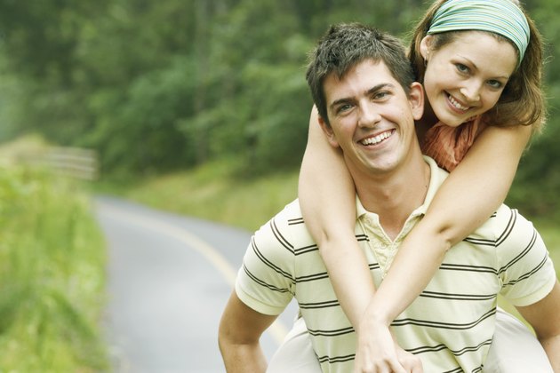 Man carrying woman on his back