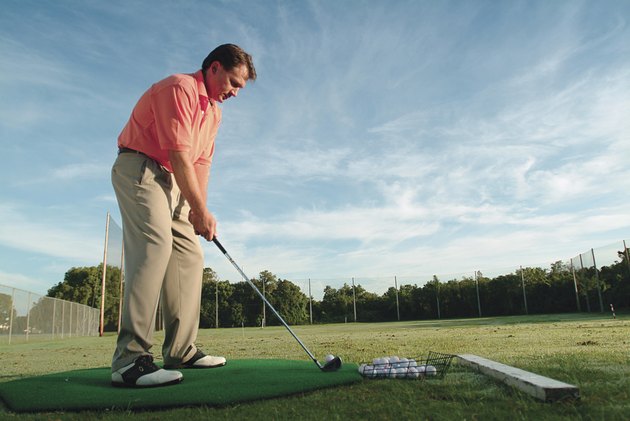 Man practicing golf