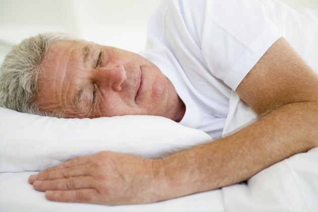 Man lying in bed sleeping