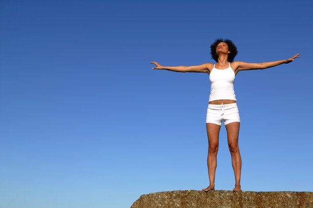 Woman standing on cliff